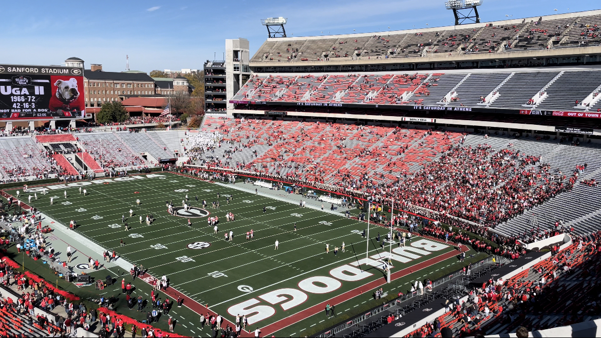 The football field and red-clad spectators in Sanford Stadium at the University of Georgia.